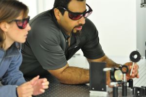 Mohammad and Kelsie adjust optics